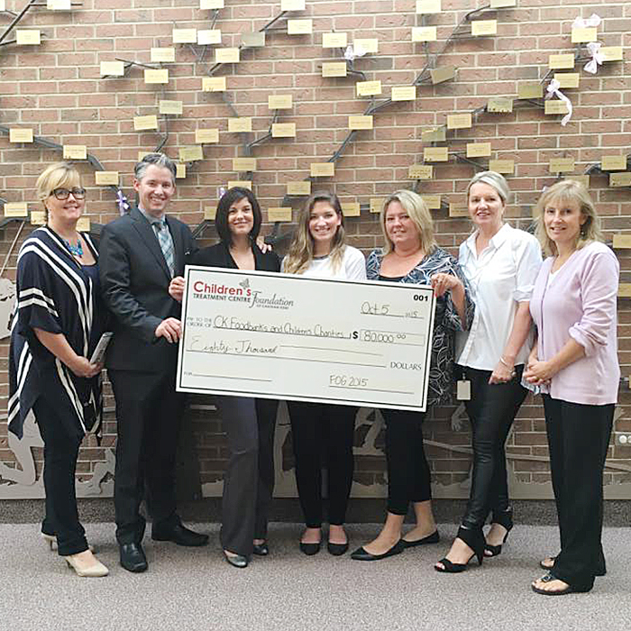 FOG committee members, from left, Marnie Ball, Darrin Evans and Tina Evans (Co-Chairs), Shelby Sanchuk, Toni Martin, Cindy Gillett, and Donna Litwin-Makey are seen with the $80,000 donation to local charities.
