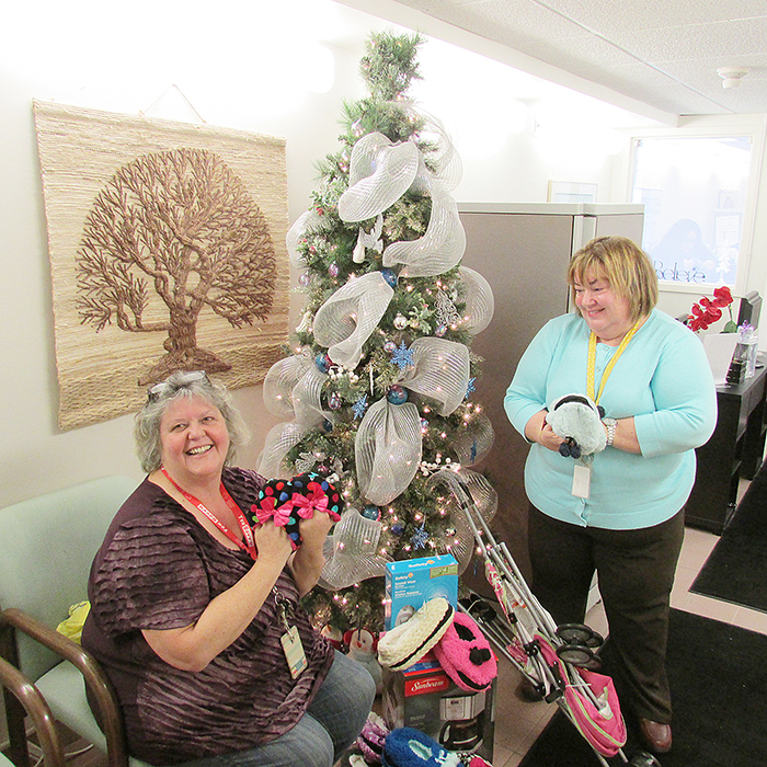 Laurie Willick and Nina Kirkland-Kelly of the Chatham-Kent Women’s Centre show some of the donations left by a donor last week.