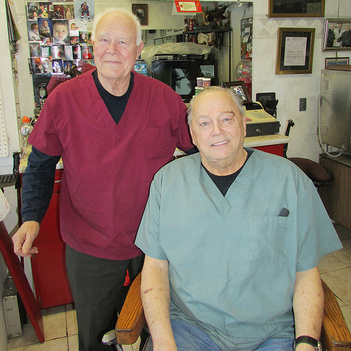 Ted Ritchie, left, and Mike McGuire are both in their 70s and very happily still come to work every day at Mike and Ted’s Barber Shop. 