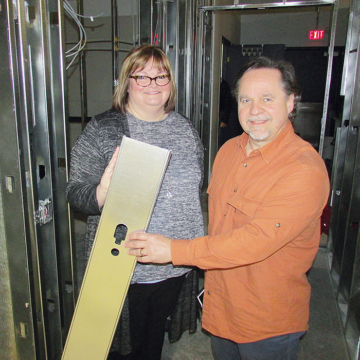 Michelle Repuski of Goodwill Industries and Ken Hyra, an employment resource worker with Chatham-Kent, check out one of the beams being used to build a lunchroom and washroom facility at Goodwill’s Recycling Centre in Chatham.