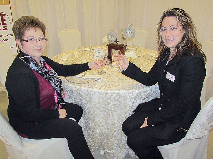 Bride-to-be Pam Langstaff, right, along with her mom, Norma Langstaff, were at the Wedding Show Saturday at the John D. Bradley Centre to check out what area vendors had to offer to make her day perfect. Par-Tee Rentals from Petrolia had several tables set up to show brides different options for dinner service décor. Langstaff plans to tie the knot June 11 and was happy for the opportunity get some ideas and options for her wedding day. 