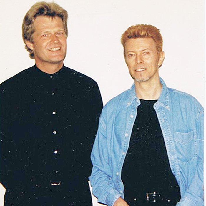 Glenn Smith, left, and Davie Bowie, worked together very briefly in 1996, as Bowie released the first pay-for-download single by a major artist. (Contributed Image)