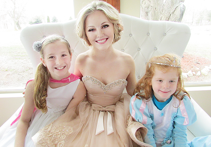 Chatham’s Brooklyn Roebuck, centre, takes a moment with student volunteer Paige Lachine, 11, and princess for a day Sophia Murphy, a Kindergarten student at St. Ursula’s School, at the second annual Once Upon a Snowball fundraiser at Links of Kent on Saturday.