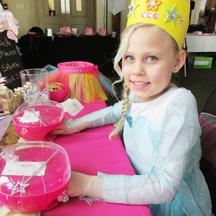 To complete her princess for a day ensemble, Isabella Gernaey, 8, from George P. Vanier School, gets her nails done at the second annual Once Upon a Snowball fundraiser at Links of Kent on Saturday.