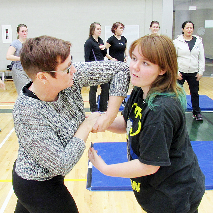 Jennifer and Destiny Hache practice some of the self-defence techniques taught by Henrie Timmers at his 12-week course at St. Clair College.