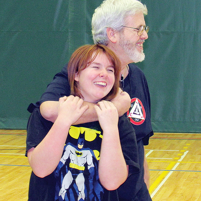 Henrie Timmers and Destiny Hache go through some of the moves taught during his Women’s Self-Defense course at St. Clair College.