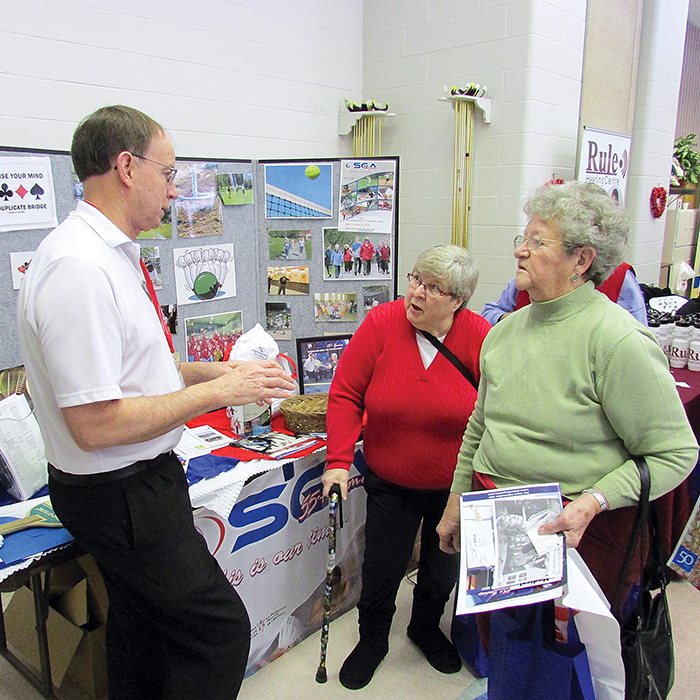 The seventh annual Senior Resource Expo held at the Active Lifestyle Centre attracted more than 500 people Friday. The event featured more than 75 exhibitors. Here, Don Hector of the C-K 55 Plus Games visits with Fran McGoldrick and Patricia Atkinson.