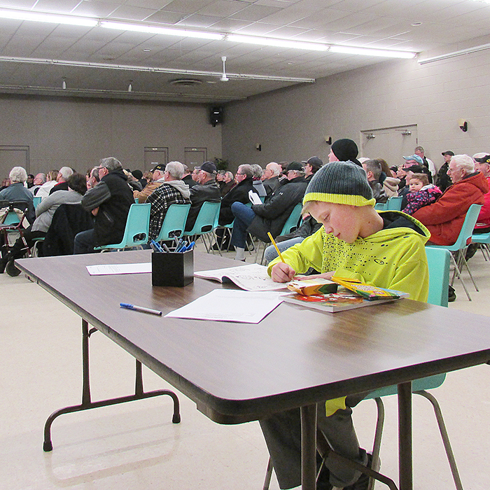 Nine year-old Ryan Bowen kept busy colouring Thursday night as his parents and more than 150 other local residents attended a meeting to discuss the future of Wallaceburg’s water supply.