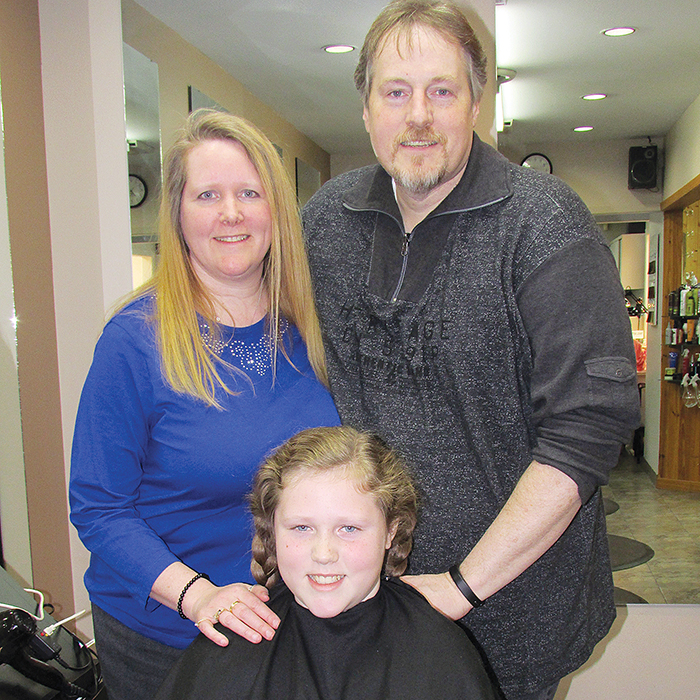 Johnathon Core, shown with proud parents Kim and Chris, showed real guts, standing up to bullies as he grew his hair out to help make a wig for a child battling cancer.