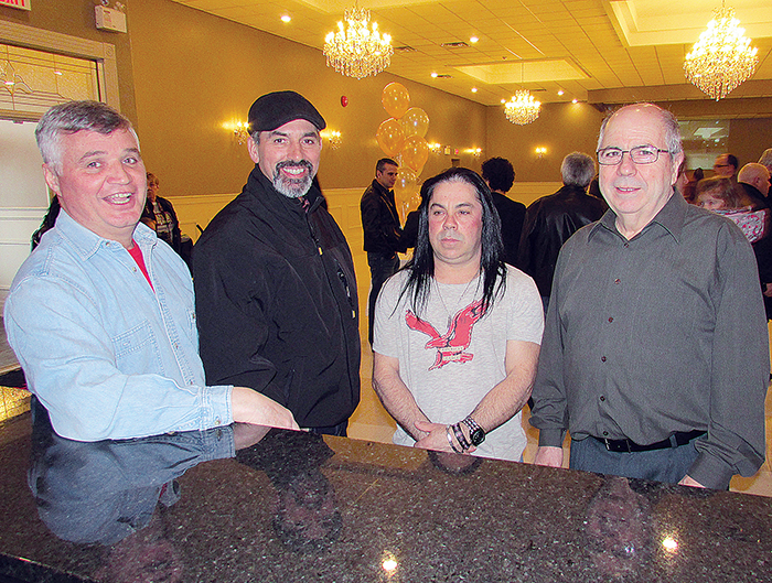 From left, Dominic do Forno, Tony de Abreu, Paulo Carniero and Antonio Pisquem were just some of the folks on hand Sunday to enjoy the grand re-opening of the Portuguese Canadian Social Club in Chatham. The quartet also had a large hand in the renovation effort that took eight weeks.