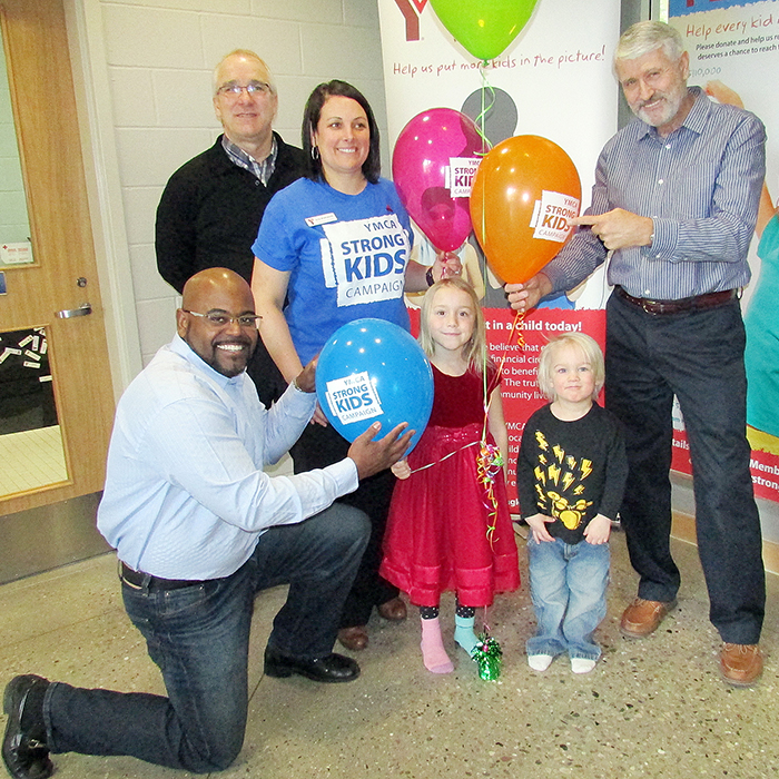 From left, DeLano Collier, Jim Janzen, Ella and Ben LaPierre, and Jim Loyer kick off the YMCA’s annual Strong Kids campaign Feb. 19. Strong Kids, with a goal of $110,000 this year, is designed to help fund local YMCA programs that help better the lives of children and youth from families with financial barriers.