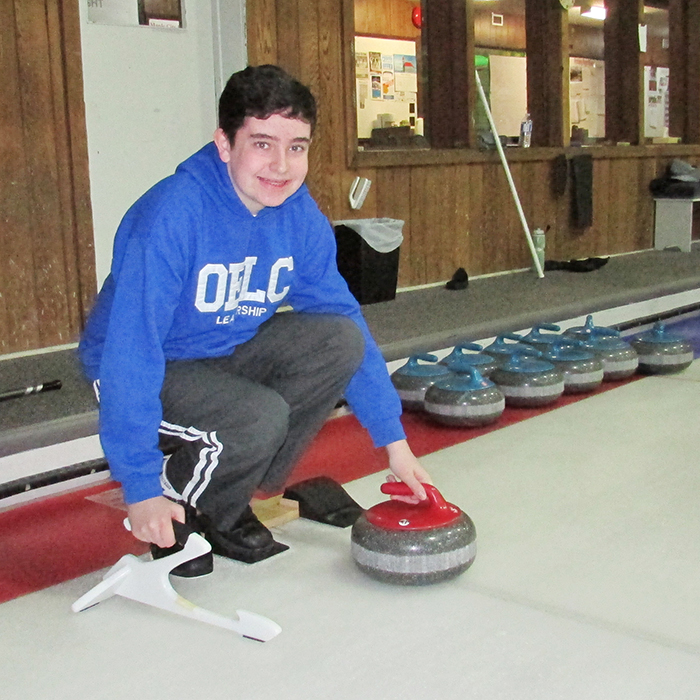 Ethan Hobbs prepares to deliver a rock during the second annual Toques and Mittens Bonspiel held to raise funds for the Shriners Hospital for Children in Montreal. The event raised $4,200.