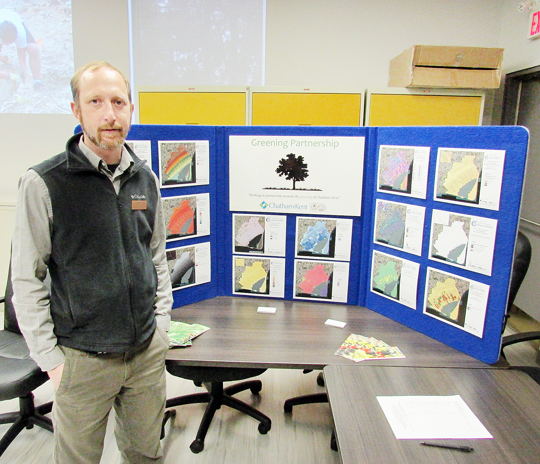 Greg Van Every of the Lower Thames Valley Conservation Authority stands next to a display showcasing the work of the Green Partnership program, a joint effort with the municipality of Chatham-Kent.