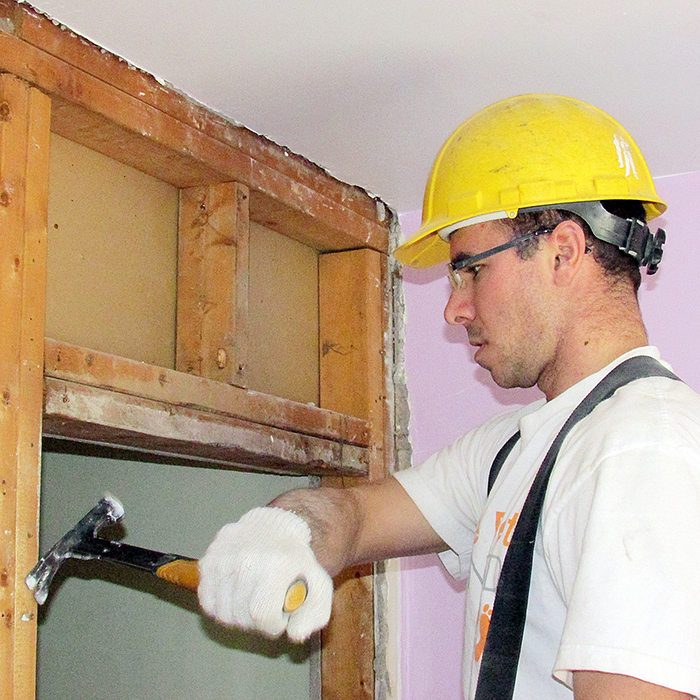 Steve Thibeault of Bouma Builders was one of several workers on site Monday gutting the interior of a Chatham home to make it more accessible for a nine-year-old Chatham girl who’s returning to the city after spending seven months in hospital after suffering a stroke.