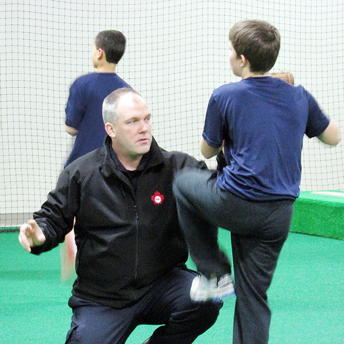 Weeks before major league baseball players reported to Florida and Arizona for spring training, a group of young Chatham-Kent athletes began spring training of the own, right here in Chatham. Here, coach Jason Chickowski works with Kurt Countryman on his throwing mechanics.