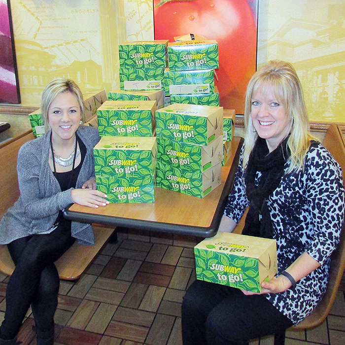 Nicole Roeszler of Chatham-Kent Community Living and Lisa Fisher, an options teacher with the Lambton Kent and St. Clair District School boards, were busy organizing deliveries of more than 1,500 boxed lunches today as part of the annual fundraiser.