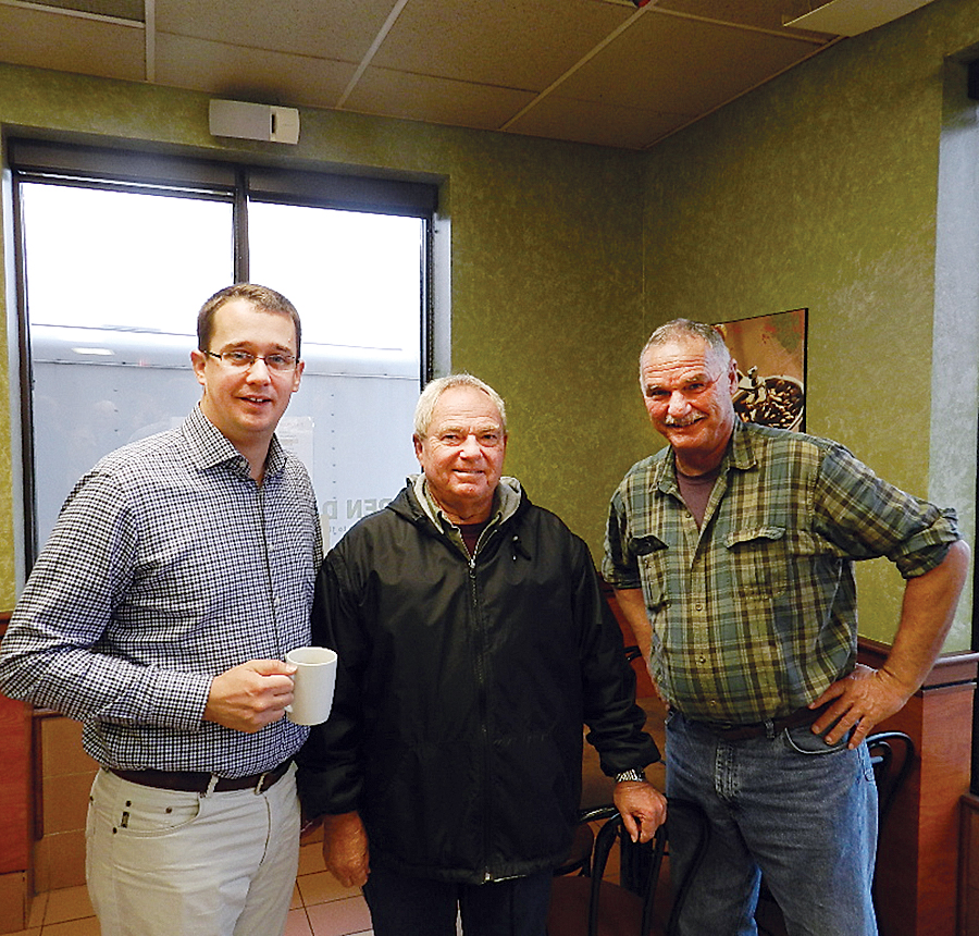 Lambton-Kent Middlesex MPP Monte McNaughton met with Wallaceburg area property owners Monday to discuss approval of the latest wind farm project in the area. Here, McNaughton (left) speaks with Larry Janssens and Al Kerkhoff, local landowners opposed to the project.