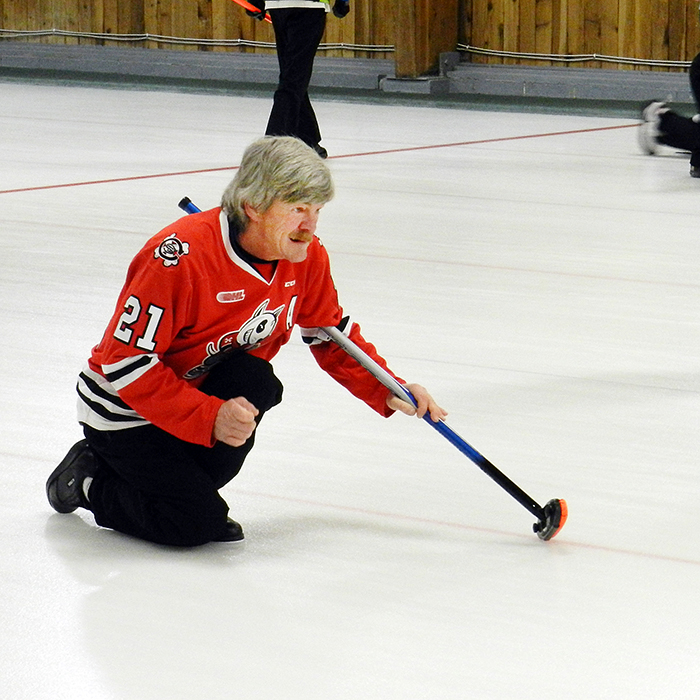 Don Verhaeghe of Wallaceburg watches his shot during the 39th annual Crazy Legs Bonspiel that was held last weekend at the Sydenham Community Curling Club.