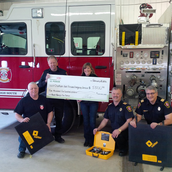 The South Raleigh fire station received a donation from  DuPont Pioneer to purchase emergency equipment. Here are (left to right) firefighter Ken Wood, Acting Station Chief Scott Russell,  Pioneer sales representative Julie Rhodes, Chief Ken Stuebing, and Assistant Chief Bob Davidson. 