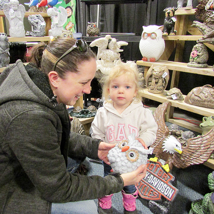 Two-year-old Emmalee Randall of Blenheim and her mom Karen made some new friends at the 2016 Chatham-Kent Home and Garden Show as they checked out the Southwestern Ornamental Concrete display. The show returns this weekend.