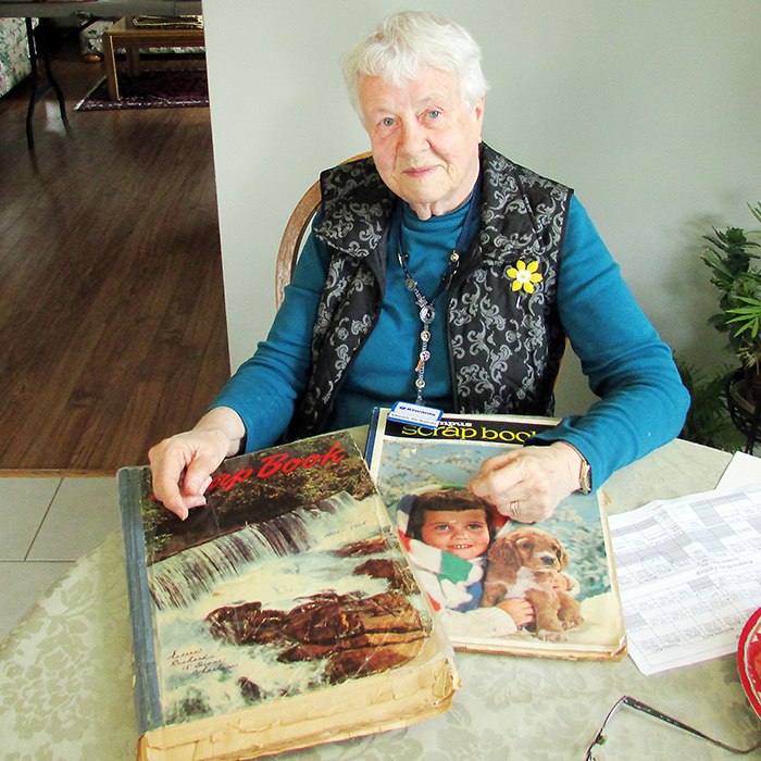Eileen Richards participated in the first-ever Kiwanis Music Festival in 1945 and continues to volunteer for the event today. Here she is with some of the scrapbooks detailing the festival during the decade plus that she was secretary.