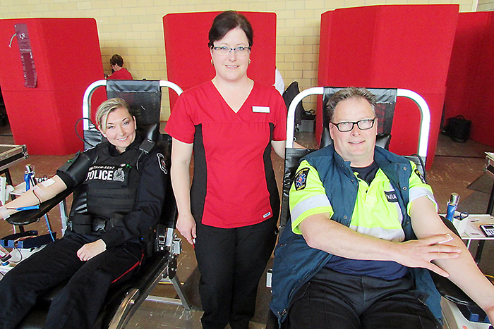 CKPS Const. Lynette Hodder, left, and paramedic David Huffman, right, were on hand today to give blood. Today marked Hodder’s third donation and it was number 34 for Huffman. Phlebotimist Beth Cassidy, centre, with Canadian Blood Services took good care of emergency personnel during the donations.