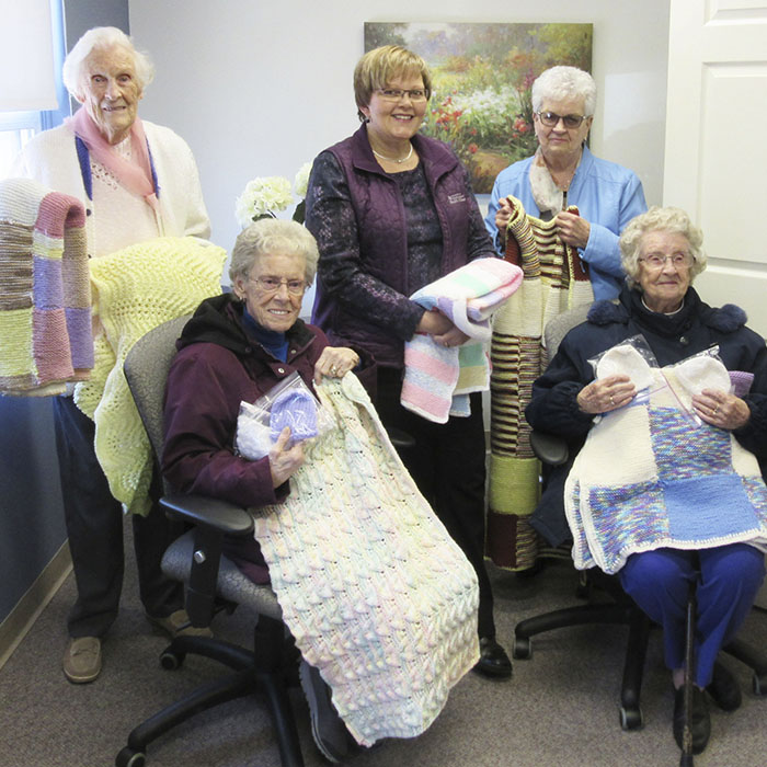 Hudon Manor residents made and donated blankets to the Foundation of the Chatham-Kent Health Alliance. Pictured left to right are Kay Vickerman, Lydia Dorion, Residents, Hudson Manor Retirement Residence; Lucy Hartford, Office Coordinator, Foundation of CKHA; Betty McGuire, Volunteer, and Joy Mellow, Resident, Hudson Manor Retirement Residence.