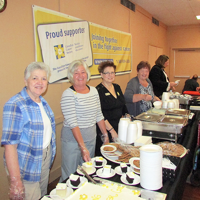 Volunteers man their stations at the annual Chatham Retirement Resort Cooking for Cancer fundraiser event.