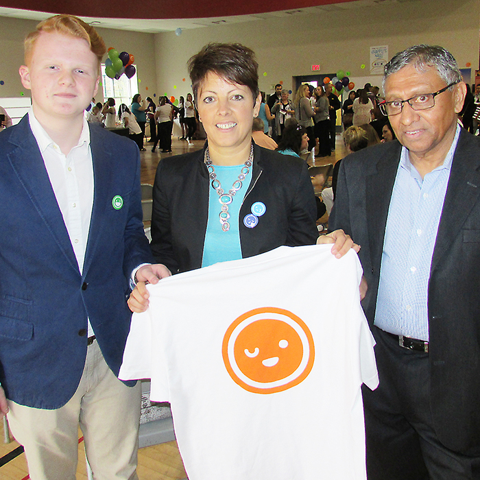 Several hundred people were on hand Monday to help celebrate the launch of ACCESS Open Minds, a hub for co-ordinating all mental health services for youth under one roof. Here, Youth Advisory Committee member Chaz Langford; Paula Reaume-Zimmer, Integrated Vice President, Mental Health & Addictions Services, CKHA; and CKHA chief of staff Dr. Ranjith Chandrasena show off one of the ACCESS T-shirts before the event.