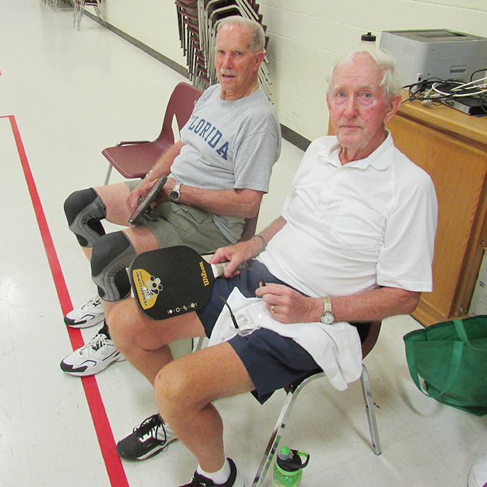 Harvey Nicholson (left) and Albert Mast take a break during a session of pickelball at the WISH Centre recently.