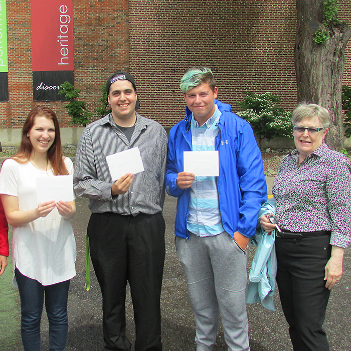 The Chatham-Kent Film Group presented $1,000 bursaries to three local students who will be enrolling in post-secondary film studies courses this year. Here (left to right) are film group member Irena Carey, winners Julianna Corso, Anthony DeWael and Riley Rhodes and Cindy Storey of the film group.