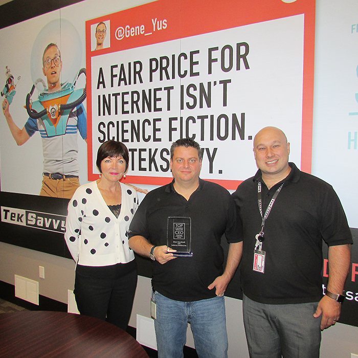  Marc Gaudrault was named TOP Telecom CEO of the Year at the recent Canadian Telecom Summit in Toronto. Marc (centre) is shown with TekSavvy Chief Financial Officer Catherine Playford and Chief Operating Officer Pierre Aube Jr.