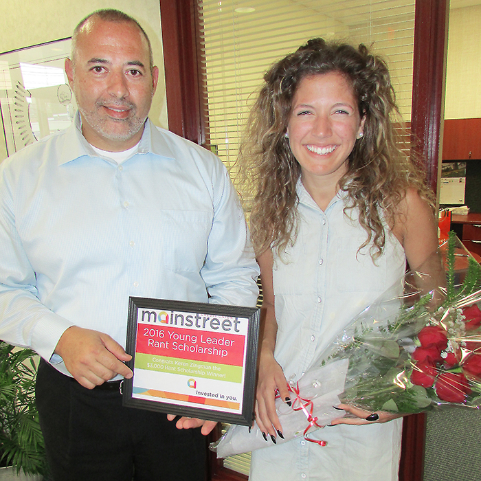 Mainstreet Keil Drive branch manager in Chatham, Joe Presutto, presented Keren Zingman with a scholarship cheque for $3,000, a certificate and a bouquet of roses on recently.