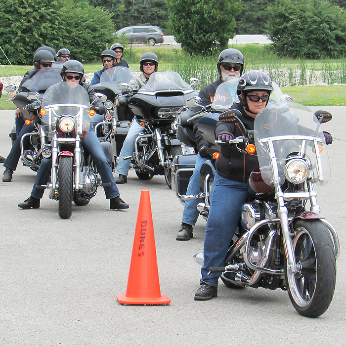 Participants in the third annual VON Motorcycle Poker Rally prepare to head out from Duke’s Harley-Davidson Saturday morning.