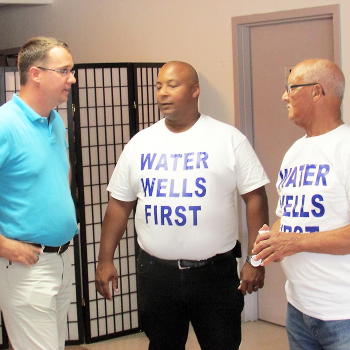 Lambton-Kent-Middlesex MPP Monte McNaughton chats with members of Water Wells First at a recent public meeting to discuss the proposed Otter Creek Wind Farm north of Wallaceburg.