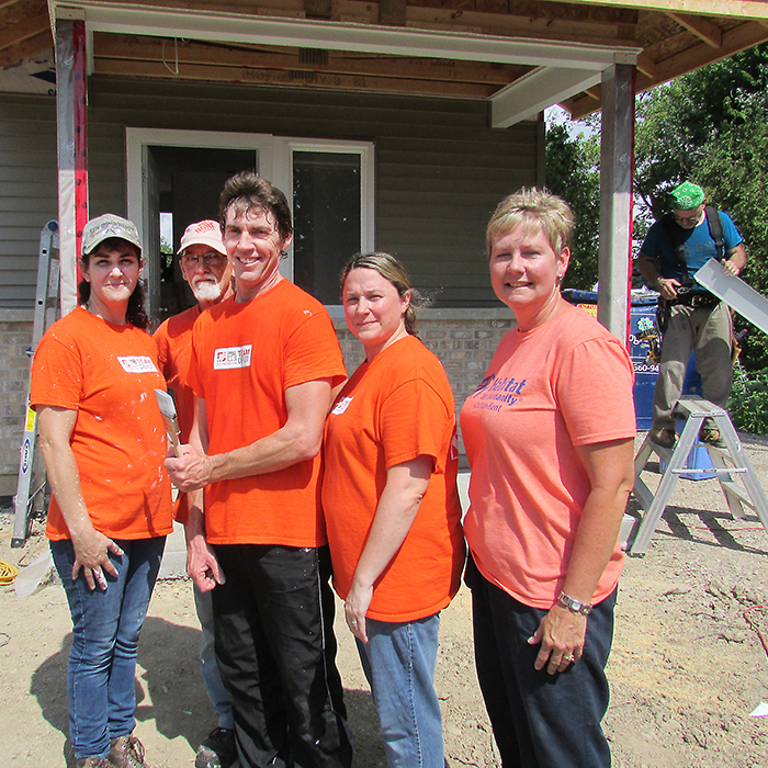 The team from Home Depot was at the Habitat for Humanity build in Charing Cross during the recent scorching heat to put primer on the walls on a home the organization has for a lucky family. The home is expected to be finished and ready to hand over to the family in September. Volunteering, from left, is Carmen Mohr, Gary Risdale, Dan Dymock, Marnie McKean from Home Depot, with Habitat executive director Nancy McDowell.