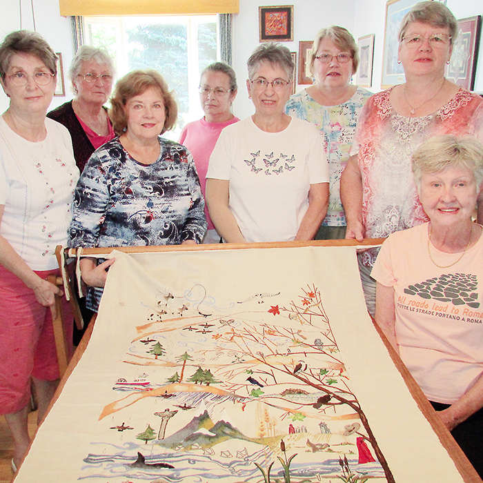 Members of the Tulip Tree Needlearts group showcase work on one of the panels they are working on as part of an embroidery project to celebrate Canada’s 150 anniversary of Confederation. The panel is making its way around the east side of the country to groups that are part of the Embroidery Association of Canada (EAC). The other panel is making the rounds on the west side of Canada.