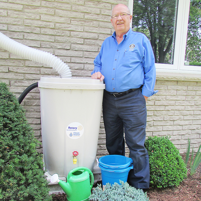 John Lawrence shows off a rain barrel at his home. Rain barrels are part of the Clean Water for Living project, an initiative by the Rotary Club of Chatham Sunrise.