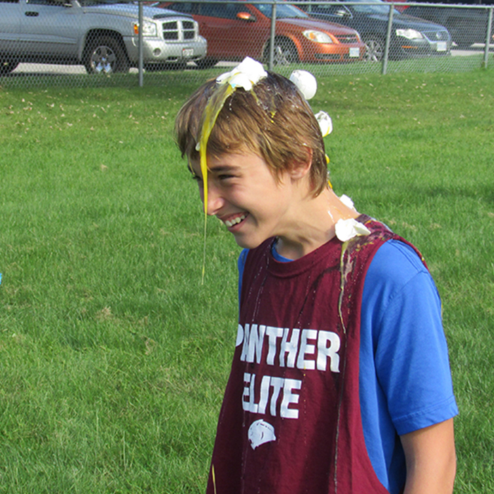 Students from local high schools were put through their paces Wednesday afternoon as part of the Fed Feather Animal House Olympics. Here a John McGregor student gets a raw egg shampoo as part of the event.