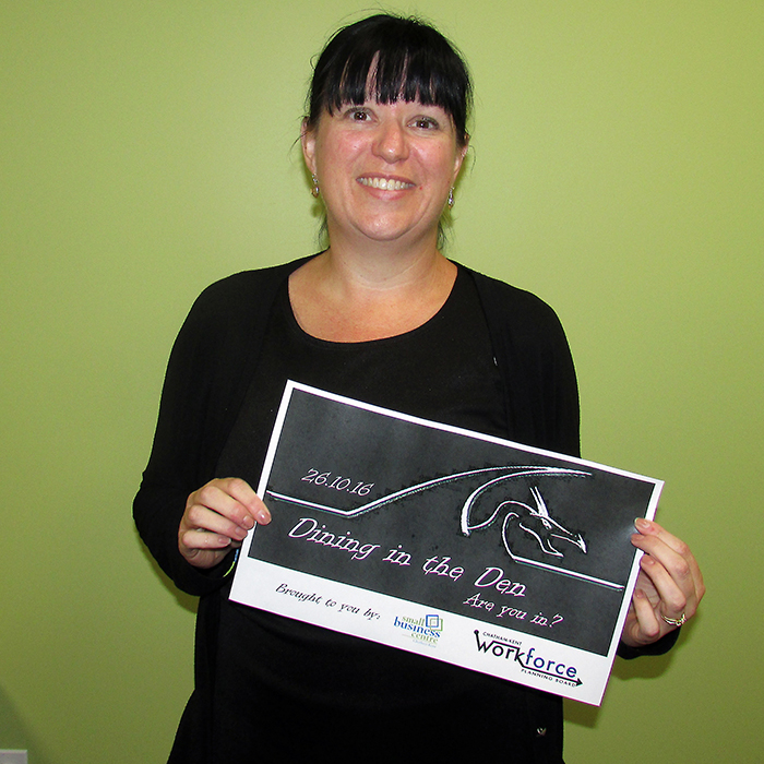 Kristy Jacobs holds a poster for the coming Dragon’s Den style celebration of small business to be held October 26 at the Chilled Cork. The winner of the competition will receive $5,000.