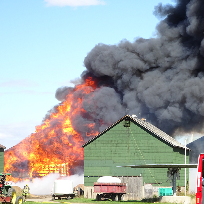 Firefighters from four stations battled a blaze on Erieau Road Sunday. Some $300,000 in property was destroyed while another $360,000 was saved. Photo courtesy Gail Lovell