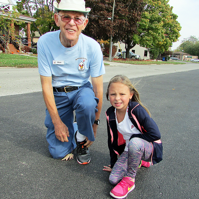 Merv Jaques prepares for his 80th birthday party with the help of his grand niece Brianna McLellan, 8. Jaques plans on walking the distance of a marathon Nov. 18, with proceeds from his fundraising effort going to support Ronald McDonald House in London. It’s a place Brianna’s family utilized when she was born prematurely, and again when she required spinal surgery at age three.