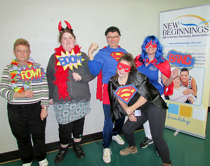 Stroke and brain injury survivors, family members and community professionals joined “superpower” forces at the second annual Stroke Survivor Congress recently at the St. Clair College Healthplex in Chatham. Pictured in Superman’s Crystal Cave to “re-charge” their powers are brain injury survivors, from left, Elaine Konecny and Shelby Emery with event emcee Peter Martin (Superman) from Cogeco Cable, New Beginnings co-op student Katelyn Schram and New Beginnings fitness instructor Beverley Risdale.