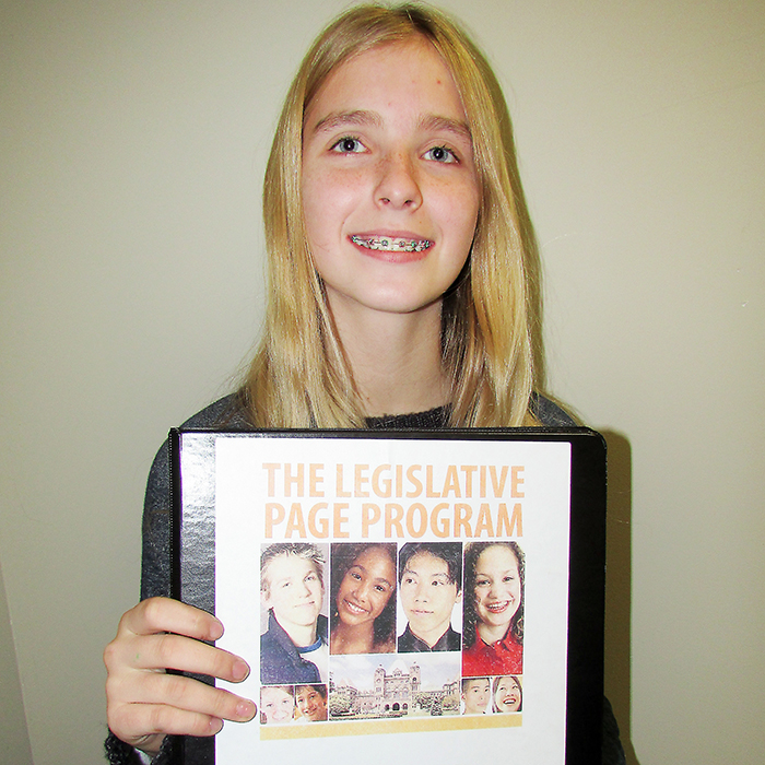 Victoria Armstrong, 13, studies names and faces of Ontario’s Members of Provincial Parliament as she heads off to serve as a page for three weeks.