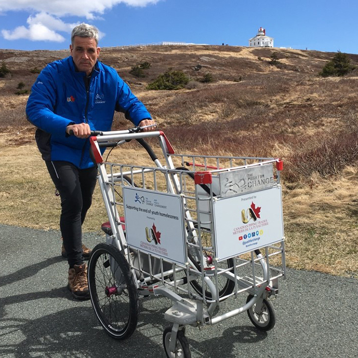 Joe Roberts uses a shopping cart as a symbol of youth homelessness during his cross-country journey, Push for Change, to raise funds for and awareness of the issue.