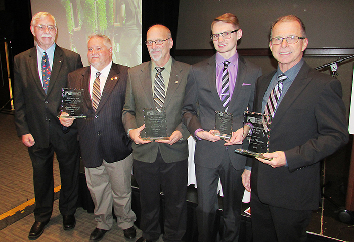 From left, Tom Storey and David French of Storey Samways Planning; Tim Schinkel of Schinkel’s Legacy; 4-H member Shaun Sullivan; and Dave Baute of Maizex Seeds – who were all honoured at the Nov. 23 4-H dinner at the Bradley Centre