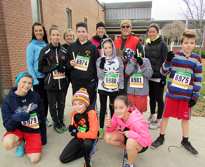 Doug Robbins of the Maple City Mile Run Club gathered with students who completed a 5K run at the conclusion of an eight-week learn to run and nutrition pilot project at Victor Lauriston Public School in Chatham recently.