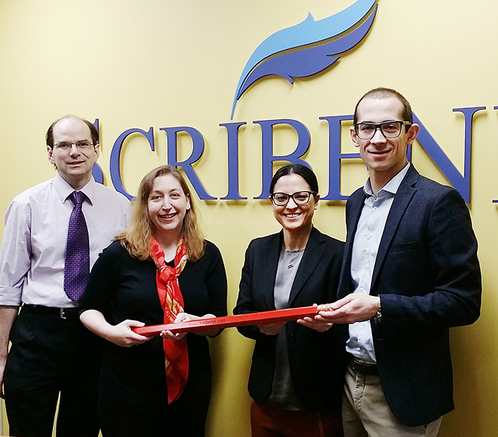 From left, Terry Johnson and Chandra Clarke, former vice-president and president respectively of Chatham-based Scribendi, have sold the business to new owners Patricia Riopel, president; and Enrico Magnani, CEO. The new owners are relocating to Chatham from Montreal.