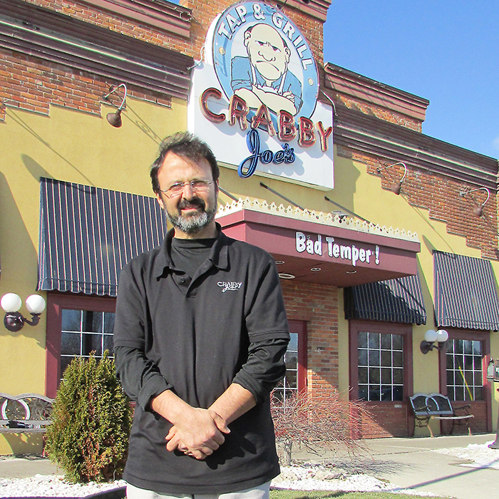 Dan Chahbar stands outside Crabby Joe’s in Chatham, a roadhouse he’s owned and operated for the past 18 years. He’s sold the business to focus on spending more time with his young family.