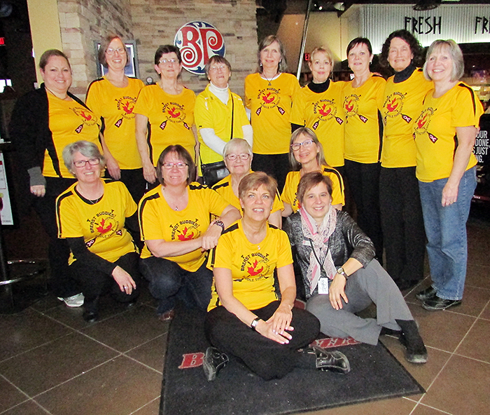 The Breast Buddies Dragon Boat Team recently held a fundraiser at Boston Pizza as the team gears up for international competition next year in Italy. With the team is Boston Pizza manager Mary Frances Kluka.